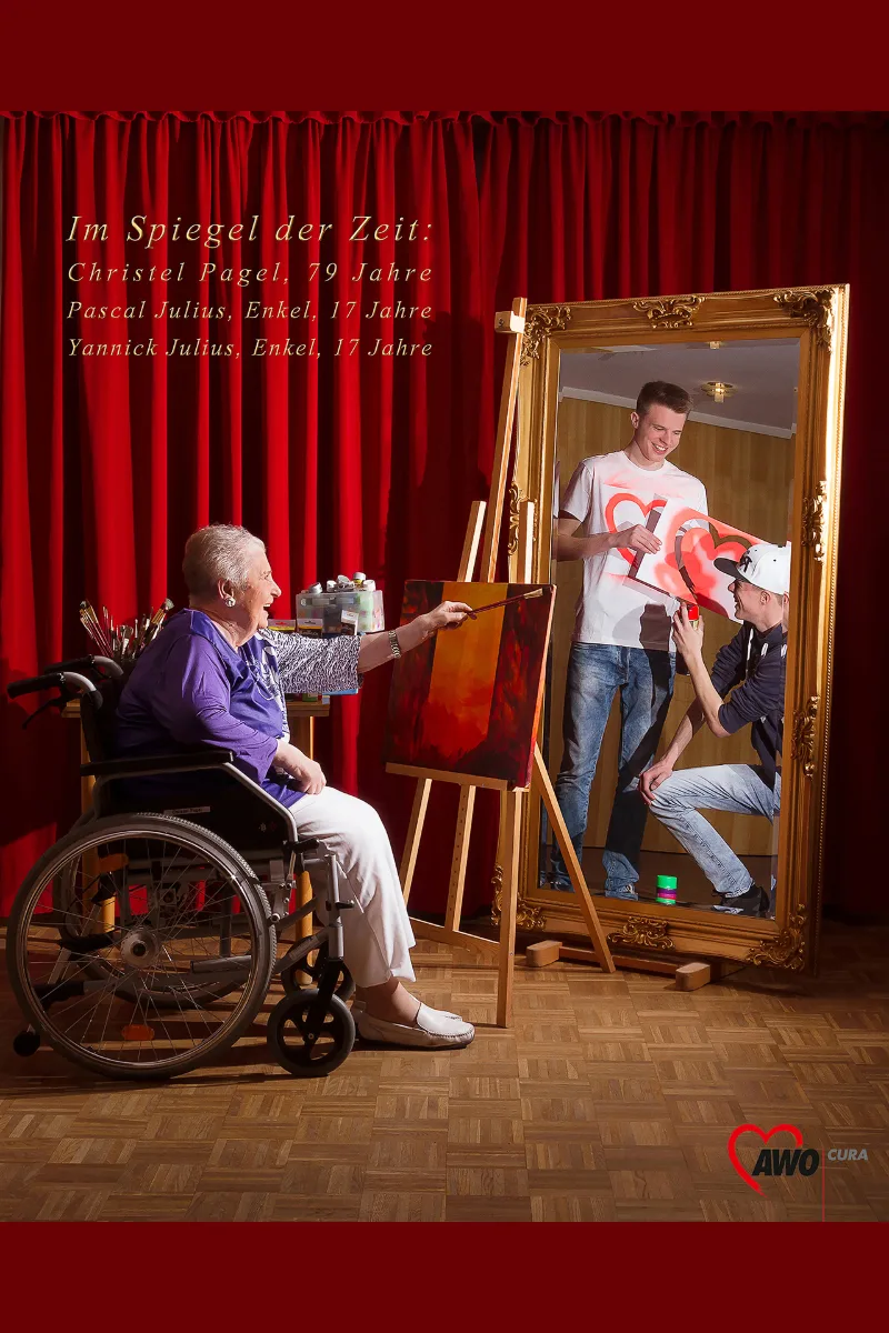 Staged portrait in front of a red theatre curtain: Christel Pagel (79) in a wheelchair painting at an easel while her grandsons Pascal and Yannick (17) spray graffiti in the baroque mirror